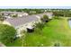 Lush backyard with mature trees and a covered patio with view of the pond at 6706 47Th N St, Pinellas Park, FL 33781