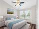 Inviting bedroom with a cozy bed, warm accents, and natural light from a window at 6706 47Th N St, Pinellas Park, FL 33781