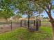 Well-maintained community dog park with black chain link fence and green spaces at 6706 47Th N St, Pinellas Park, FL 33781