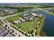 Gorgeous aerial view of community pool, tennis courts and pristine landscaping at 6932 Old Benton Dr, Apollo Beach, FL 33572