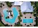 Overhead view of community pools with a waterslide, lap pool, and lounge areas at 6932 Old Benton Dr, Apollo Beach, FL 33572