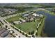 Gorgeous aerial view of community pool, tennis courts and pristine landscaping at 6932 Old Benton Dr, Apollo Beach, FL 33572