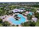 Community clubhouse and pools from above, showing tennis courts and surrounding neighborhood at 6932 Old Benton Dr, Apollo Beach, FL 33572