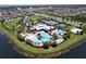 Aerial view of community pool and clubhouse with multiple pools, tennis courts, and recreational areas at 6932 Old Benton Dr, Apollo Beach, FL 33572
