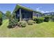 The exterior boasts a screened lanai and lush landscaping for ultimate privacy at 6932 Old Benton Dr, Apollo Beach, FL 33572