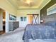 Inviting bedroom featuring art decorations, comfortable bed, and barn door for a unique touch at 6932 Old Benton Dr, Apollo Beach, FL 33572