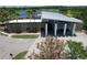 A modern clubhouse with sleek architecture and mature landscaping at 6932 Old Benton Dr, Apollo Beach, FL 33572
