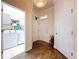 Bright entryway showcases wood floors, neutral walls, and convenient access to the laundry room at 6932 Old Benton Dr, Apollo Beach, FL 33572