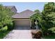 Charming single-story home with a two-car garage and well-maintained landscaping at 6932 Old Benton Dr, Apollo Beach, FL 33572