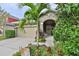 Charming single-Gathering home featuring a landscaped front yard and covered entry at 6932 Old Benton Dr, Apollo Beach, FL 33572