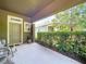 A welcoming front porch with seating offering a serene outdoor space perfect for relaxation and enjoying the neighborhood at 6932 Old Benton Dr, Apollo Beach, FL 33572