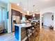 Modern kitchen featuring a large island with barstool seating and stainless steel appliances at 6932 Old Benton Dr, Apollo Beach, FL 33572