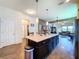 Spacious open concept kitchen and living area with kitchen island and modern decor at 6932 Old Benton Dr, Apollo Beach, FL 33572