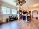 Bright open living area connected to the kitchen with hardwood floors and natural light at 6932 Old Benton Dr, Apollo Beach, FL 33572