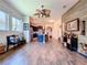 Open concept living area with hardwood floors, connecting to the kitchen at 6932 Old Benton Dr, Apollo Beach, FL 33572