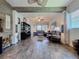 Spacious living room with hardwood floors, comfortable seating, and stylish decor at 6932 Old Benton Dr, Apollo Beach, FL 33572