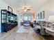 Cozy living room with plush seating, hardwood floors and large windows at 6932 Old Benton Dr, Apollo Beach, FL 33572
