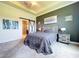 Comfortable main bedroom featuring a stylish sliding barn door and a soothing gray color palette at 6932 Old Benton Dr, Apollo Beach, FL 33572