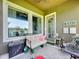 Cozy covered patio with comfortable seating and tranquil lake views at 6932 Old Benton Dr, Apollo Beach, FL 33572