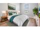 Bedroom features ample natural light, stylish decor, and plush bedding at 8576 Broadstone Dr, Wesley Chapel, FL 33544