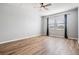 Bedroom with neutral paint, natural light, and wood-style flooring at 8576 Broadstone Dr, Wesley Chapel, FL 33544