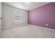 An empty bedroom shows the neutral color scheme and natural light at 8576 Broadstone Dr, Wesley Chapel, FL 33544