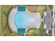 A bird's eye view of the community pool, showcasing its unique shape and amenities at 8576 Broadstone Dr, Wesley Chapel, FL 33544