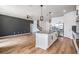Open-concept kitchen featuring stainless steel appliances, granite counters, and an island at 8576 Broadstone Dr, Wesley Chapel, FL 33544