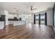 Spacious kitchen with white cabinets, granite countertops, stainless steel appliances, and lake view at 8576 Broadstone Dr, Wesley Chapel, FL 33544