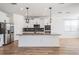 Modern kitchen featuring white cabinets, granite countertops, and stainless steel appliances at 8576 Broadstone Dr, Wesley Chapel, FL 33544