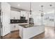 Bright kitchen with white cabinets, stainless steel appliances, and granite countertops on island at 8576 Broadstone Dr, Wesley Chapel, FL 33544