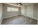 Bright bedroom features new wood-look flooring and closet with folding doors at 939 Woodland Dr, Palm Harbor, FL 34683