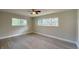 Bright bedroom showcases new wood-look flooring and ample natural light at 939 Woodland Dr, Palm Harbor, FL 34683