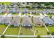 Aerial view of the neighborhood showcasing the home's backyard and screened-in patio at 944 Old Windsor Way, Spring Hill, FL 34609