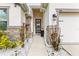 Close-up of a beautifully landscaped front entrance with decorative stone accents and a welcoming front door at 944 Old Windsor Way, Spring Hill, FL 34609