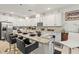 Modern kitchen island with granite countertops, stylish bar stools, and pendant lighting for an inviting space at 944 Old Windsor Way, Spring Hill, FL 34609