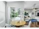 A cozy breakfast nook with sliding glass doors opening to the screened patio, seamlessly blending indoor/outdoor living at 9608 Greenpointe Dr, Tampa, FL 33626
