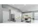 Bright, white kitchen features stainless steel appliances, a stylish backsplash, and a spacious quartz countertop at 9608 Greenpointe Dr, Tampa, FL 33626