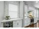 Gourmet kitchen features custom cabinets, stainless steel appliances, and a stylish wine refrigerator at 9608 Greenpointe Dr, Tampa, FL 33626