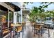 Inviting outdoor seating area at Irish 31, featuring tables, chairs, and a vibrant atmosphere at 9608 Greenpointe Dr, Tampa, FL 33626