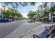 Charming streetscape with shops, apartments, and outdoor seating areas, enhanced by mature trees at 9608 Greenpointe Dr, Tampa, FL 33626