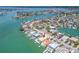An aerial view showcases the property's prime location on a waterfront street at 10126 Tarpon Dr, Treasure Island, FL 33706