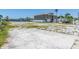 Spacious vacant lot with concrete, offering potential for a waterfront dream home at 10126 Tarpon Dr, Treasure Island, FL 33706