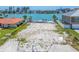 Waterfront vacant lot ready for new construction, offering a prime location with bay access at 10126 Tarpon Dr, Treasure Island, FL 33706