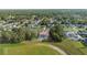 From above, a charming property nestled among lush trees, featuring a sparkling pool and serene surroundings at 10446 Baylor Dr, Spring Hill, FL 34608