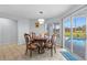 Cozy dining area with backyard pool view at 10446 Baylor Dr, Spring Hill, FL 34608