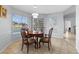 Bright dining area with tile floors and view of pool through sliding glass doors at 10446 Baylor Dr, Spring Hill, FL 34608