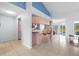 Open kitchen bar area with stools and tile flooring, ideal for casual dining and entertaining at 10446 Baylor Dr, Spring Hill, FL 34608