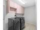 Laundry room featuring high-end washer and dryer at 10446 Baylor Dr, Spring Hill, FL 34608