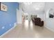 Bright living area with tile flooring, comfortable seating, and access to the pool area at 10446 Baylor Dr, Spring Hill, FL 34608